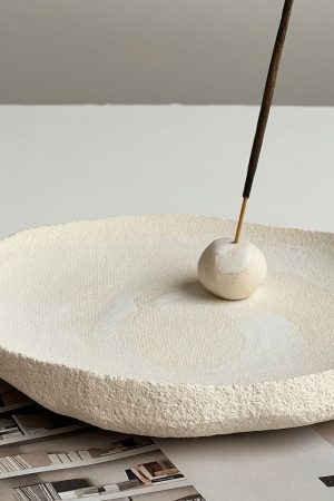 incense holder placed on the Eira Ritual Dish by Marlies Huybs