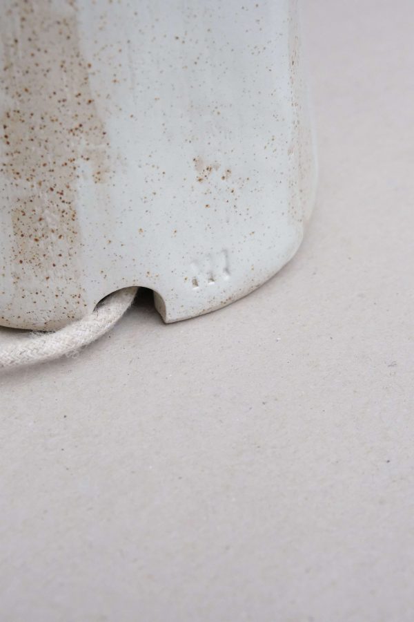 close up of the ceramic foot and wire of the Gobi Table Light by Marlies Huybs