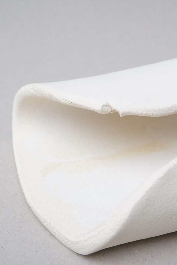 Delicate detail of the texture and organic curves of the ceramic Moon Shell by Marlies Huybs