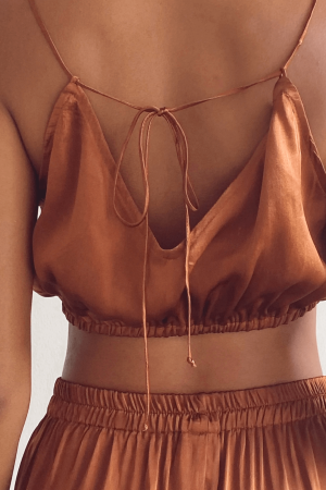 the silk Jai Top & matching Jai Pants in Coco by the brand Bahhgoose showing the adjustable tiestraps, the stretchy waistband and the silky fabric
