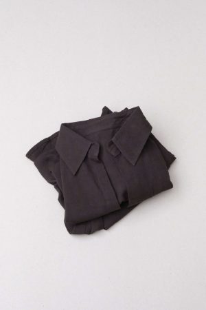flatlay of the folded Ker Button Up in Charcoal by the brand Bahhgoose