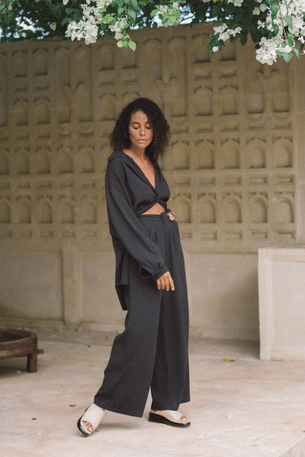 woman wearing the Ker Button Up in Charcoal with matching Ker Trousers by the brand Bahhgoose, showing the relaxed fit of this beautiful co-ord set