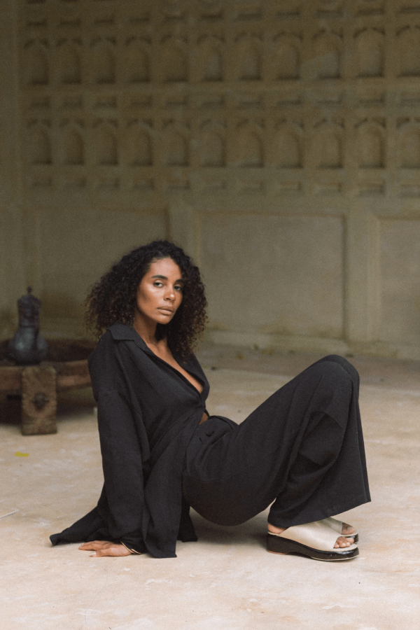 woman wearing the Ker Button Up in Charcoal with matching Ker Trousers by the brand Bahhgoose, showing the relaxed fit of this beautiful co-ord set