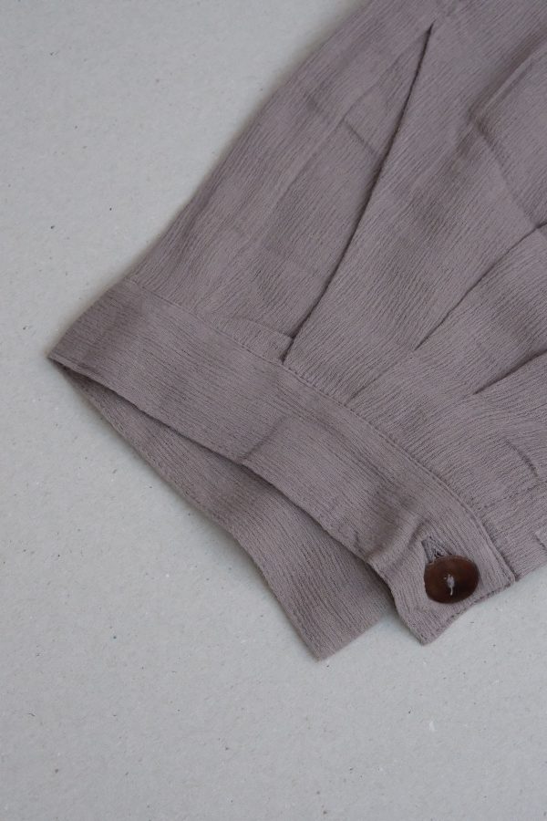 detailed flatlay of the Ker Trousers in Taupe by the brand Bahhgoose