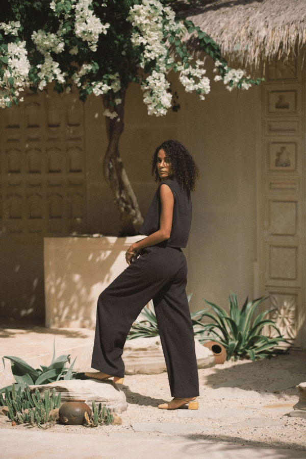 woman wearing the Ona Button Up in charcoal with the matching Ker Trouser by the brand Bahhgoose, showing the relaxed fit of this beautiful co-ord set