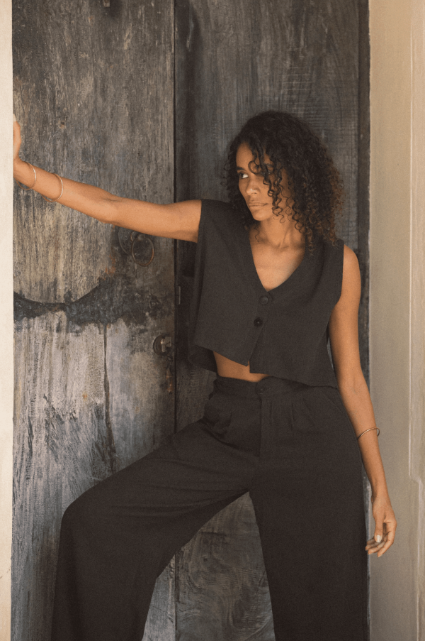 woman wearing the Ona Button Up in charcoal with the matching Ker Trouser by the brand Bahhgoose, showing the relaxed fit of this beautiful co-ord set