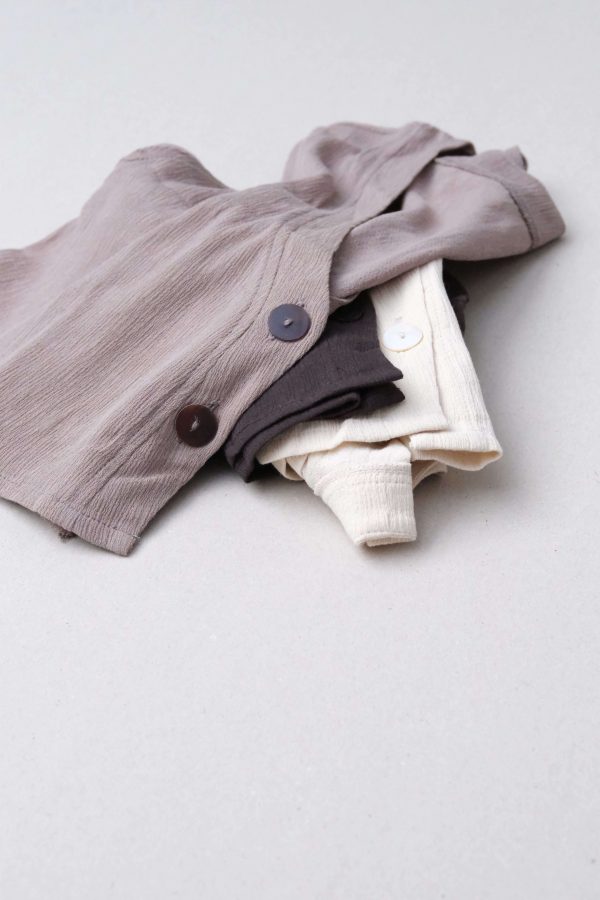 detailed flatlay of the Ona Button Up in Taupe, Charcoal & Natural by the brand Bahhgoose