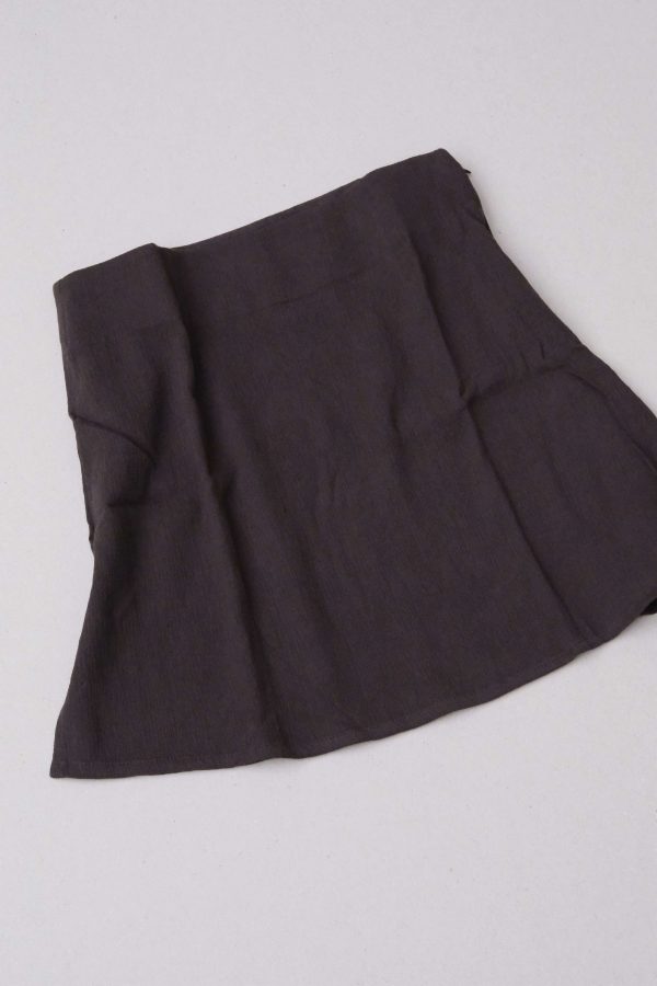 flatlay of the Ona Skirt in Charcoal by the brand Bahhgoose