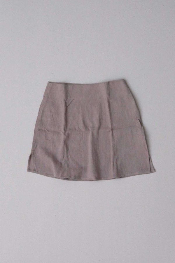 flatlay of the Ona Skirt in Taupe by the brand Bahhgoose