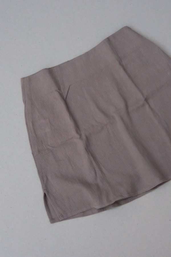 flatlay of the Ona Skirt in Taupe by the brand Bahhgoose