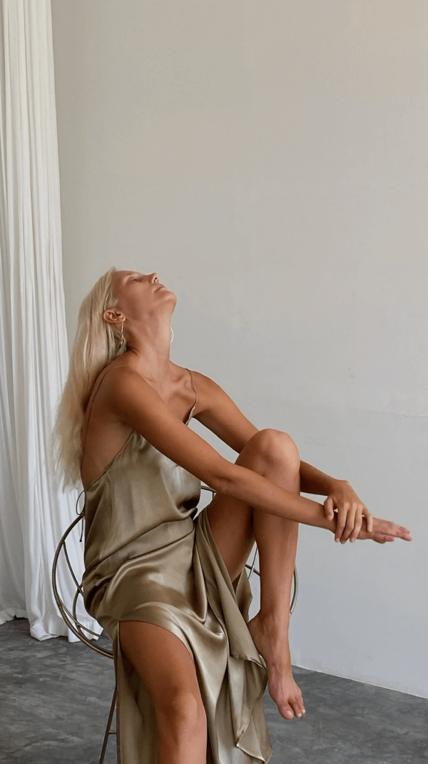 woman wearing the Silk Slip Dress in Cove by the brand Bahhgoose