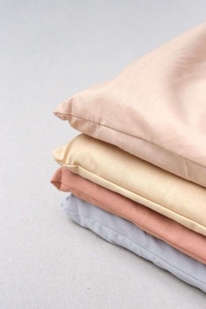 flatlay of the Base Cotton Duvet Set in Cinnamon, Grey, Honey & Nude Pink by the brand Cats and Boys