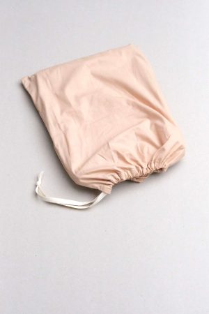 flatlay of the Base Cotton Duvet Set in Nude Pink by the brand Cats and Boys