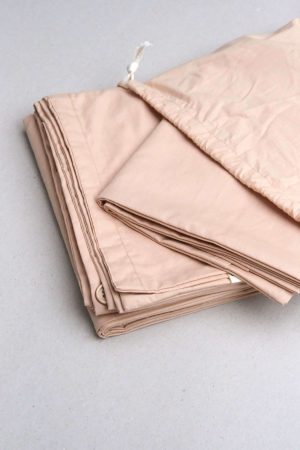 flatlay of the Base Cotton Duvet Set in Nude Pink by the brand Cats and Boys