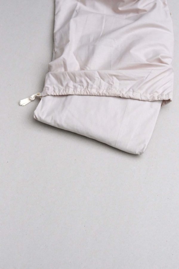 flatlay of the Base Cotton Fitted Bedsheet in Sand by the brand Cats and Boys