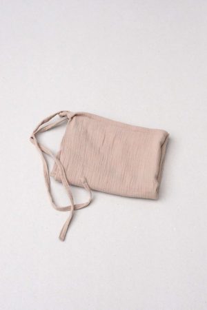 flatlay of the muslin gauze cotton dishtowel in Caramel by the brand Cats and Boys