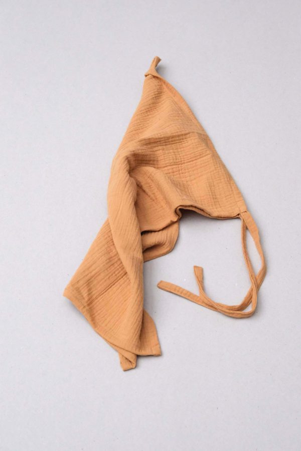 flatlay of the muslin gauze cotton dishtowel in Honey by the brand Cats and Boys