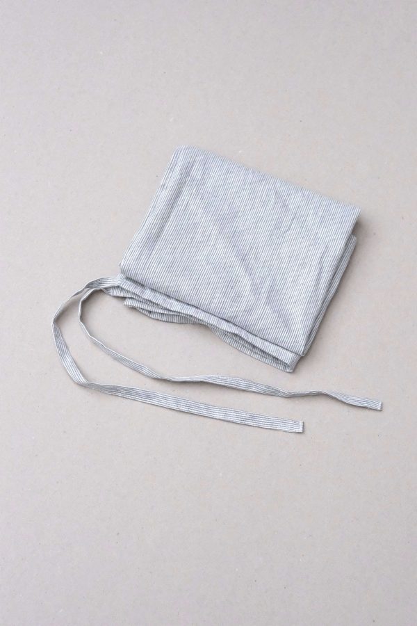 flatlay of the linen dishtowel in Grey Stripes by the brand Cats and Boys