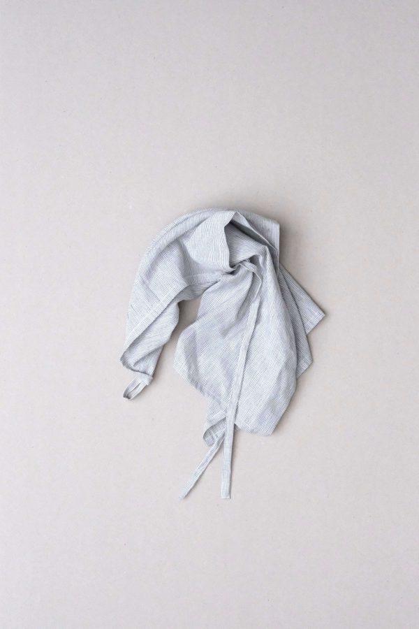 flatlay of the linen dishtowel in Grey Stripes by the brand Cats and Boys