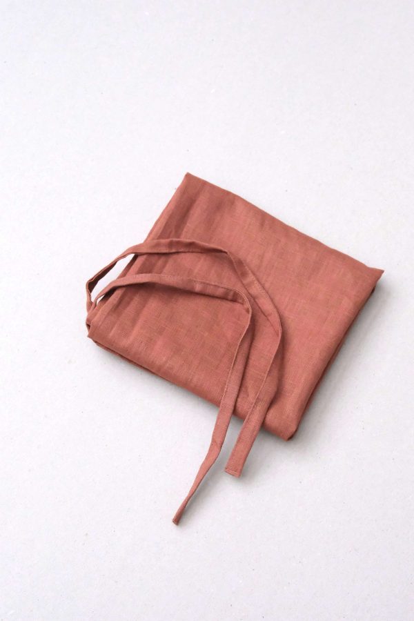 flatlay of the linen dishtowel in Rust by the brand Cats and Boys