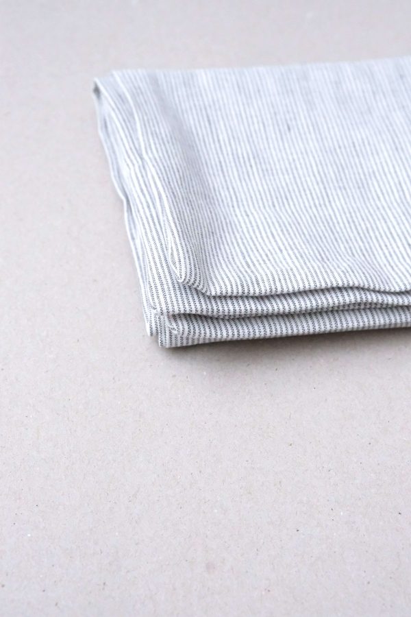 flatlay of the linen Pillowcase in Grey Stripes by the brand Cats and Boys