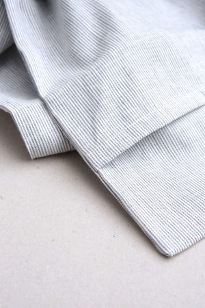 flatlay of the linen Pillowcase in Grey Stripes by the brand Cats and Boys