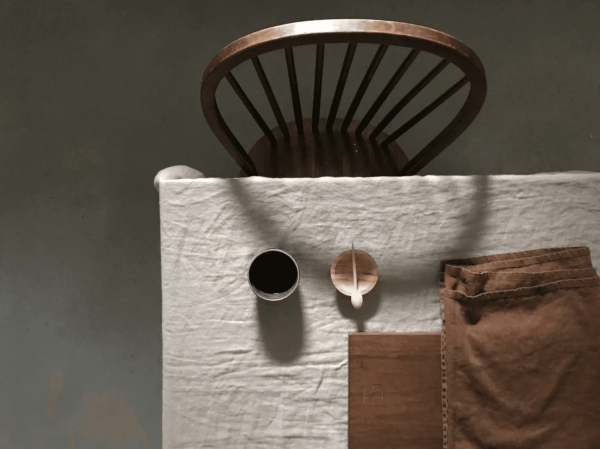 the linen table cloth in light grey by the brand Cats and Boys