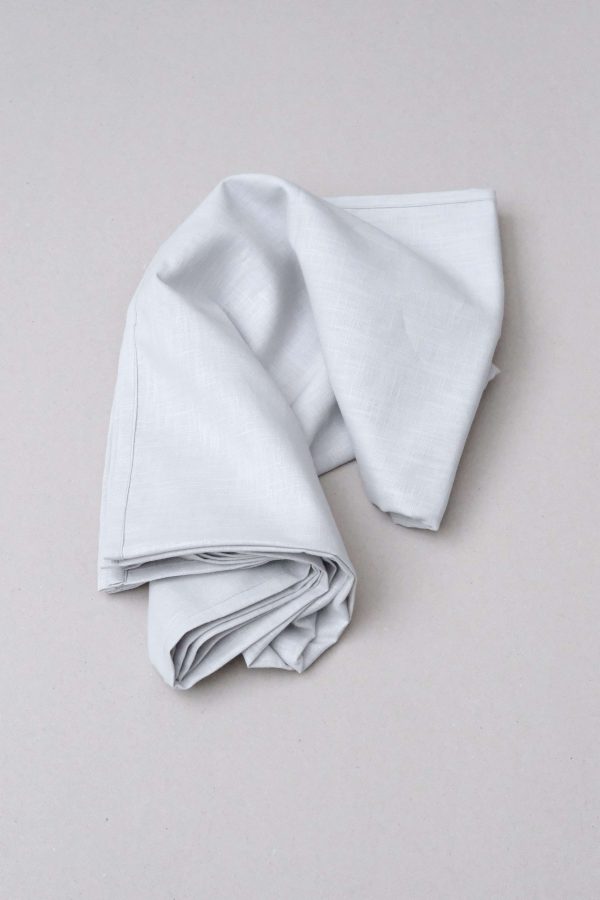 flatlay of the linen table cloth in light grey by the brand Cats and Boys