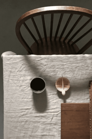 the linen table cloth in off-white by the brand Cats and Boys