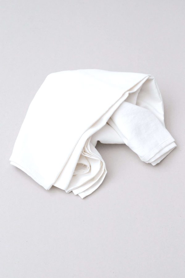 flatlay of the linen table cloth in off-white by the brand Cats and Boys