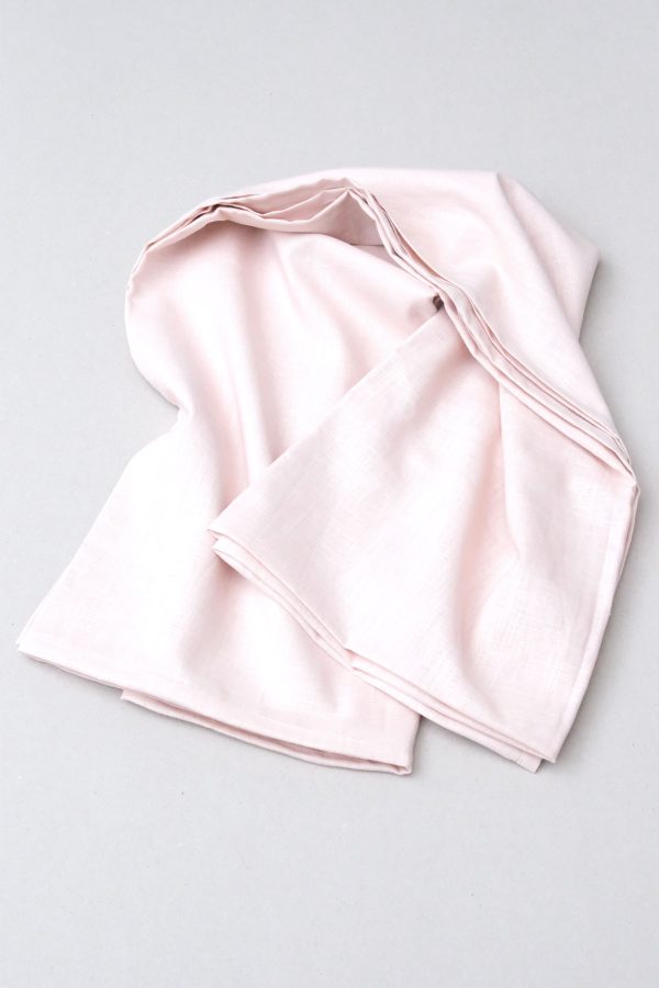 flatlay of the linen table cloth in pale pink by the brand Cats and Boys