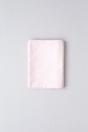 flatlay of the linen table cloth in pale pink by the brand Cats and Boys