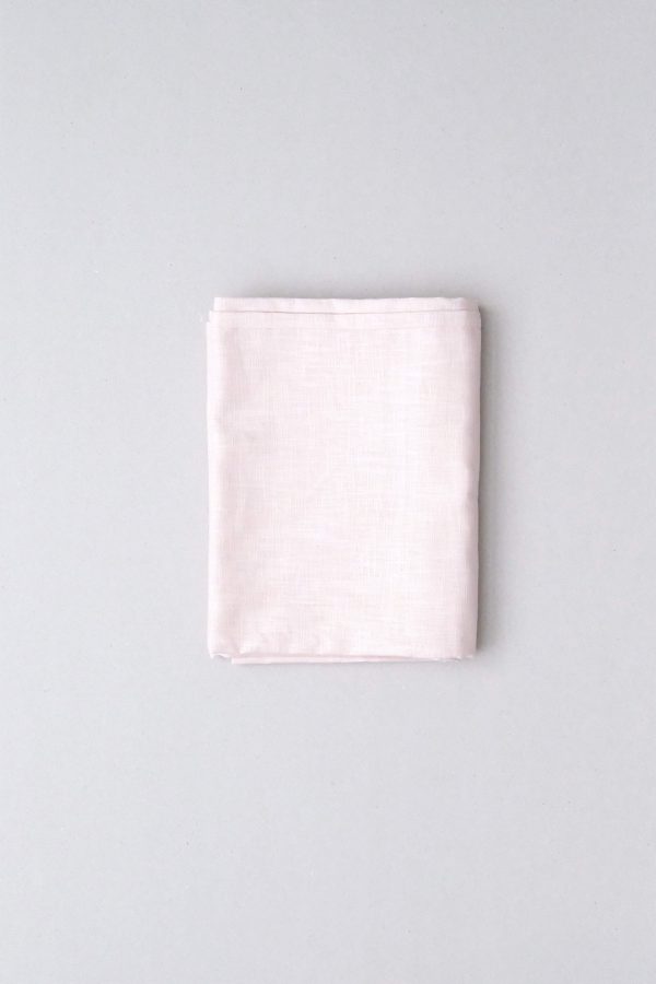 flatlay of the linen table cloth in pale pink by the brand Cats and Boys