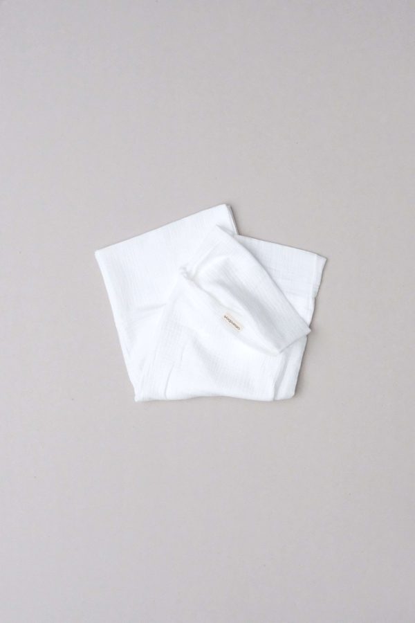 flatlay of the muslin cotton gauze Pillowcase in Milk by the brand Cats and Boys