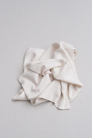 flatlay of the muslin cotton gauze Pillowcase in Natural (Undyed) by the brand Cats and Boys