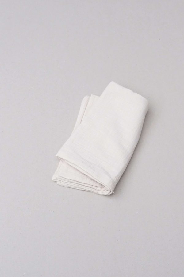 flatlay of the muslin cotton gauze Pillowcase in Natural (Undyed) by the brand Cats and Boys