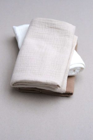 flatlay of the muslin cotton gauze Pillowcase in Natural (Undyed), milk & caramel by the brand Cats and Boys