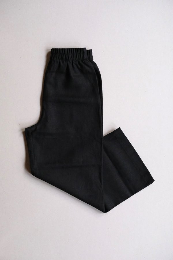 flatlay of the linen Aura Pants in Black by the brand Harly Jae