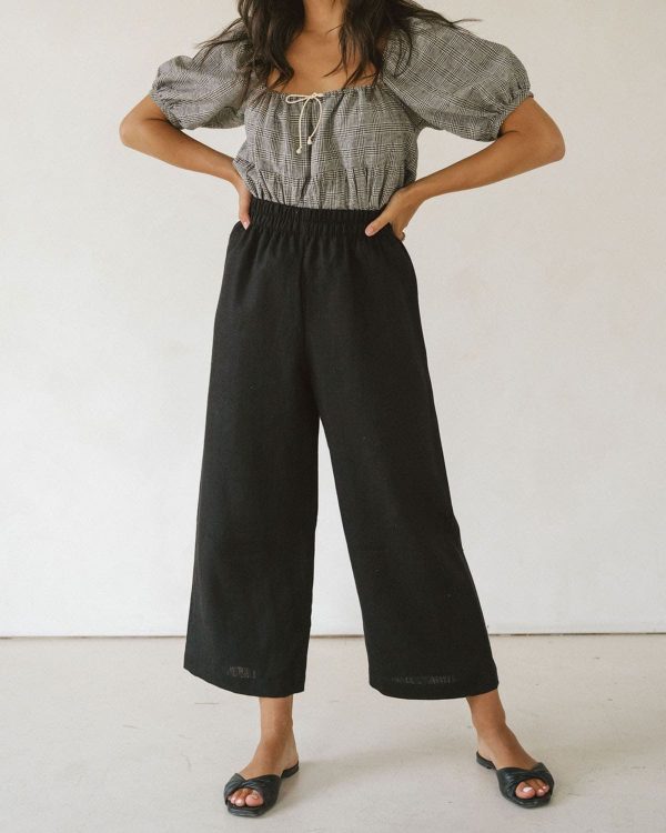 woman wearing the linen Aura Pants in Black by the brand Harly Jae