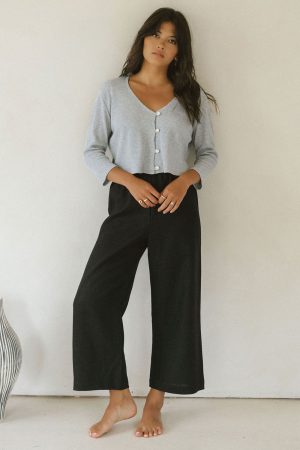 woman wearing the linen Aura Pants in Black paired with the James Blouse by the brand Harly Jae