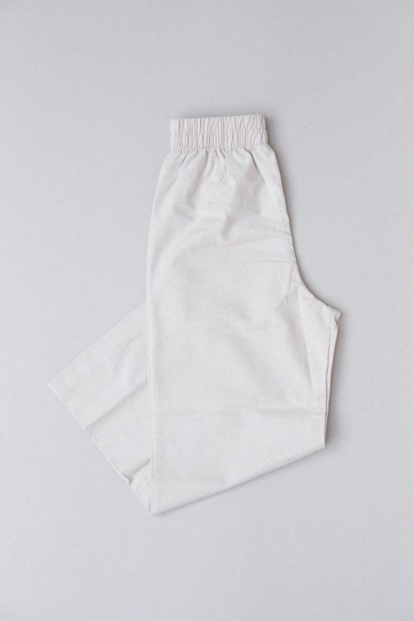 flatlay of the organic/linen Aura Pants in Natural by the brand Harly Jae