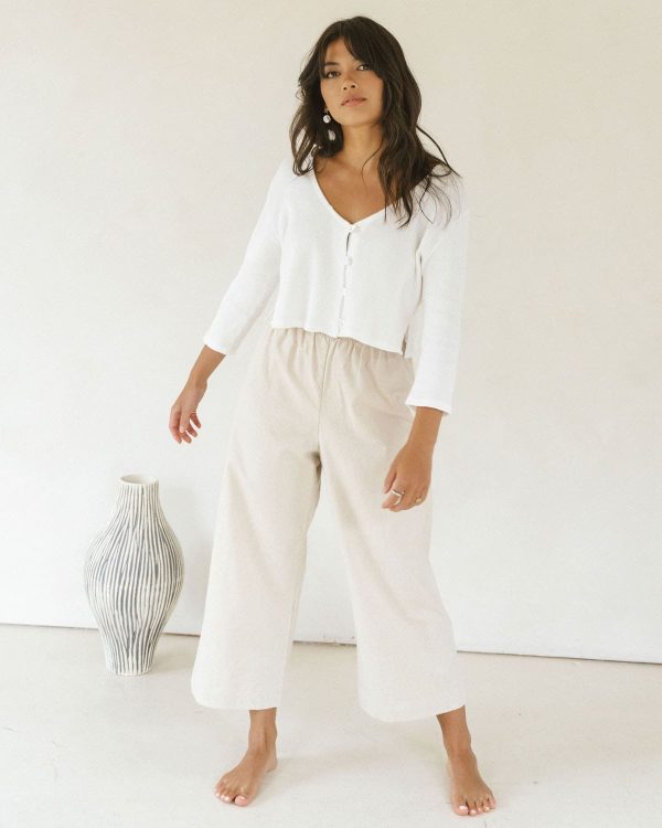 woman wearing the organic/linen Aura Pants in Natural paired with the James Blouse by the brand Harly Jae