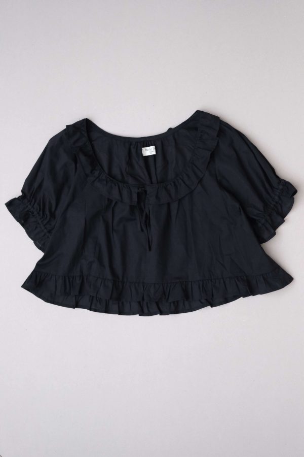 flatlay of the organic cotton Doll Blouse in Black by the brand Harly Jae