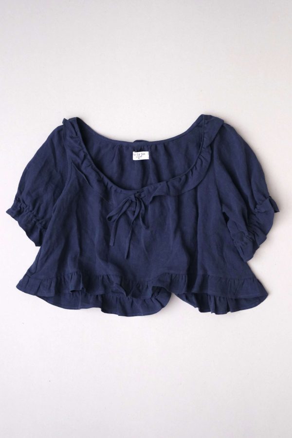 flatlay of the linen Doll Blouse in Dark Navy by the brand Harly Jae