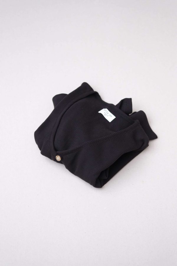 flatlay of the organic cotton waffle James Blouse in Black by the brand Harly Jae