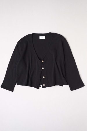 flatlay of the organic cotton waffle James Blouse in Black by the brand Harly Jae