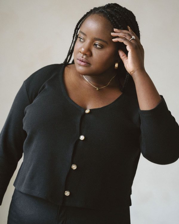 woman wearing the organic cotton waffle James Blouse in Black by the brand Harly Jae