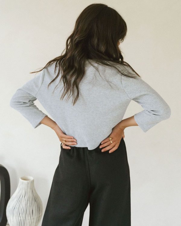 woman wearing the organic cotton waffle James Blouse in Grey Mix paired with the Aura Pants by the brand Harly Jae