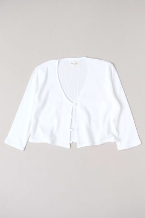 flatlay of the organic cotton waffle James Blouse in White by the brand Harly Jae