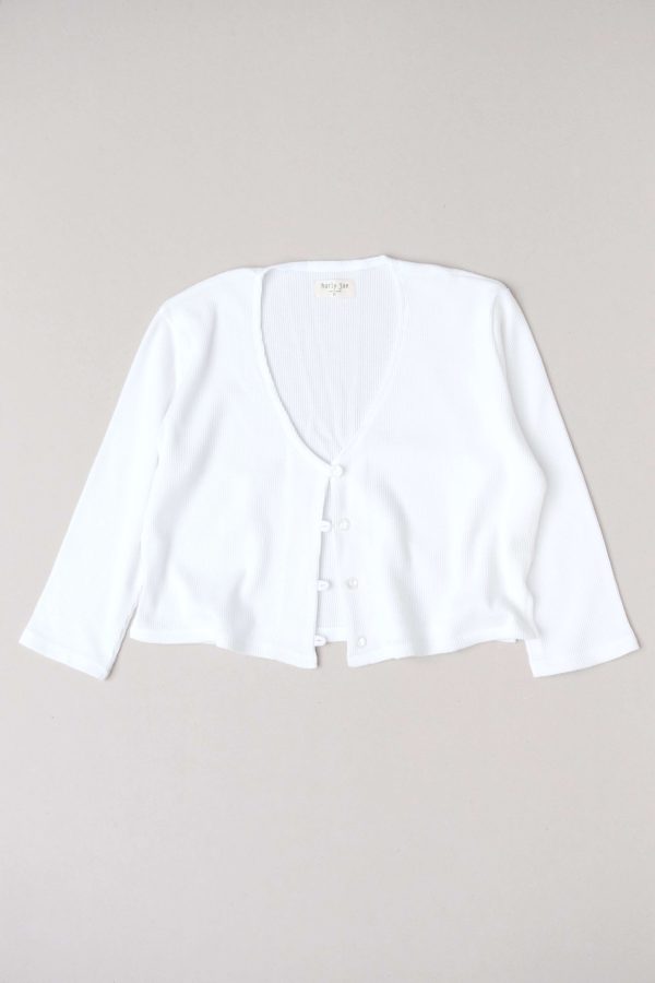 flatlay of the organic cotton waffle James Blouse in White by the brand Harly Jae